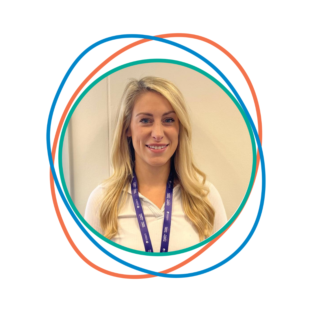 Stacey wearing white top and purple lanyard